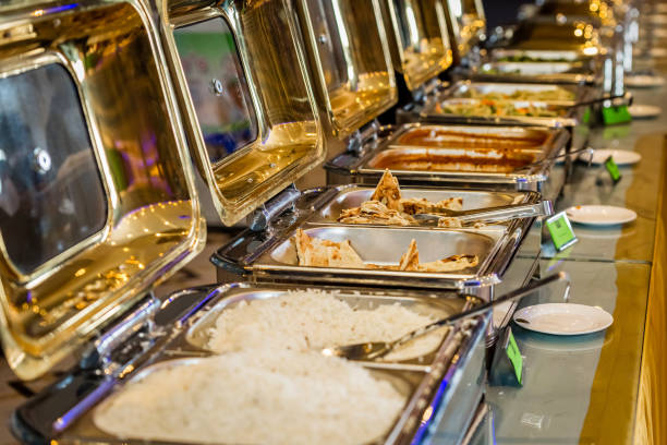 Banquet Catering food on chafing dishes.Banquet Buffet food at Indian Weddings Event.Selective Focus
